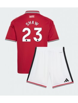 Otroški Nogometna dresi replika Manchester United Luke Shaw #23 Domači 2026-27 Kratek rokav (+ hlače)